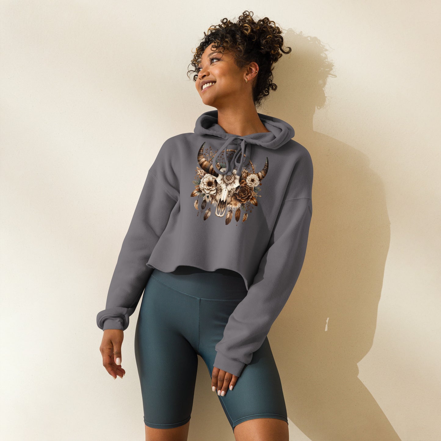 Side angle of gray hoodie with boho mandala skull and feathers