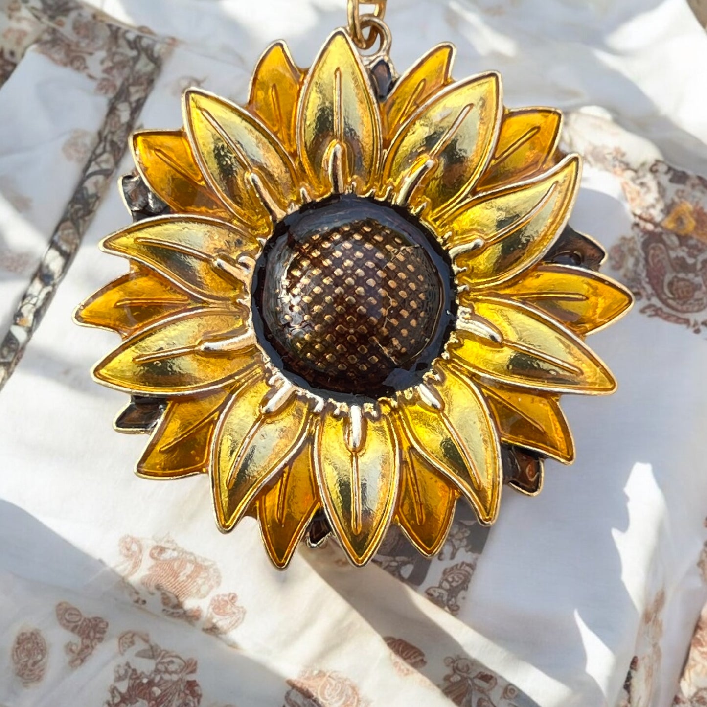 Detailed view of sunflower keychain with textured brown center
