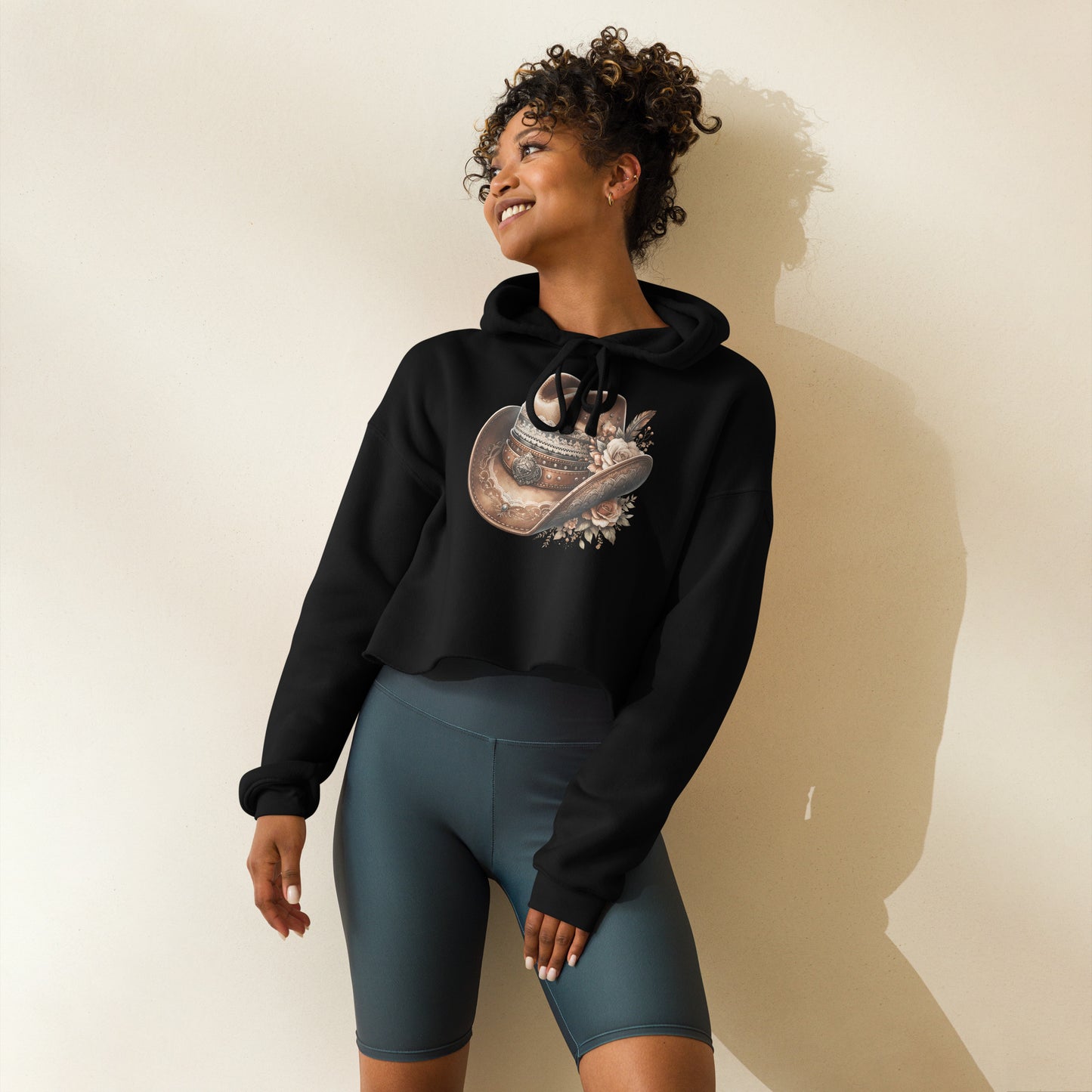 Black crop hoodie with floral cowgirl hat graphic – front view