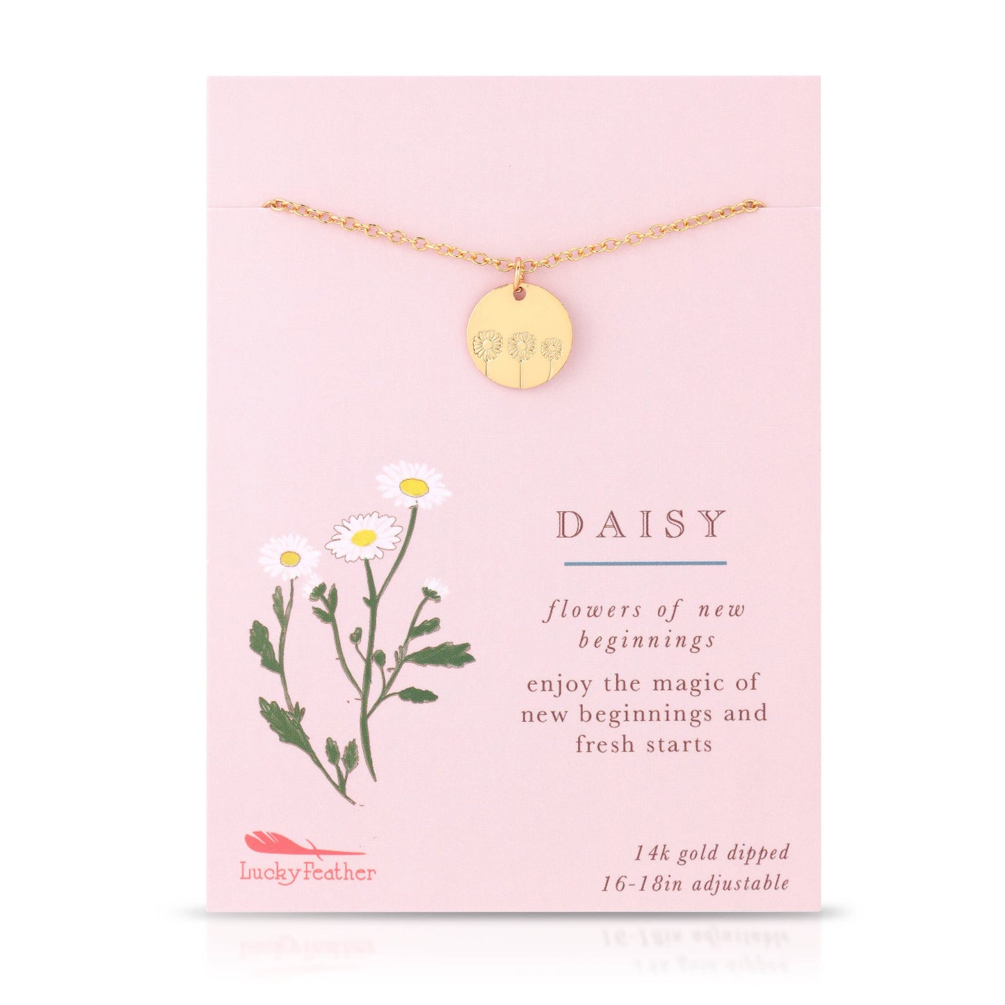 Gold daisy necklace styled with floral accents for gift display
