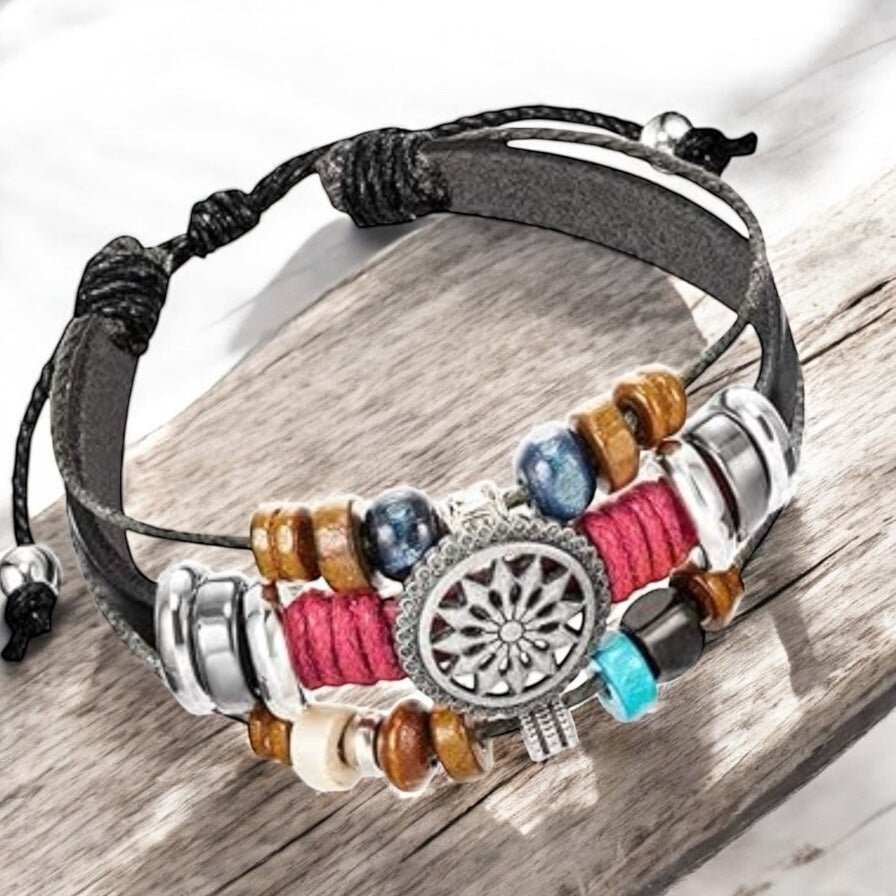 Close-up of black faux leather bracelet with wood beads and silver charm