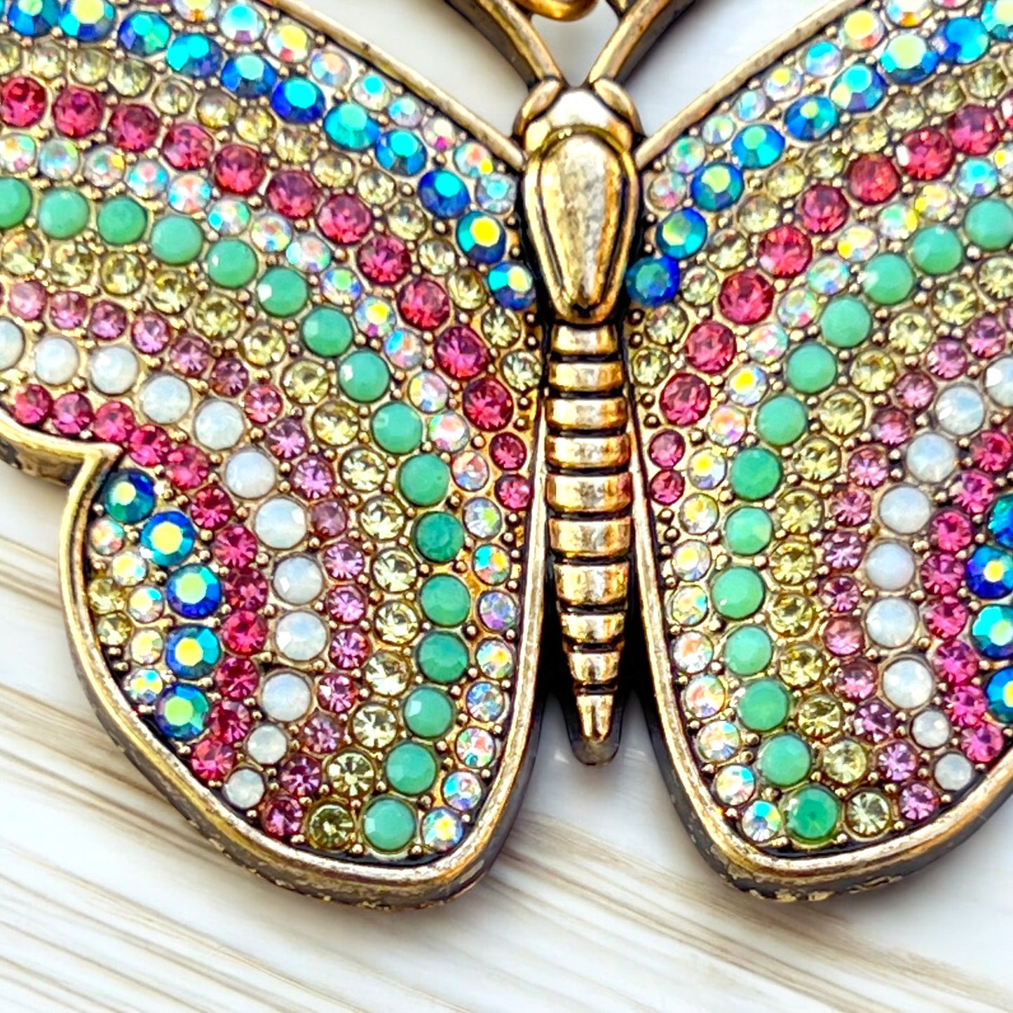 Rhinestone butterfly charm with iridescent wings and pastel color palette