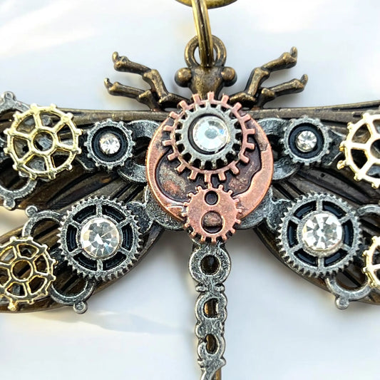 Close-up of handmade steampunk keychain with mechanical gear details