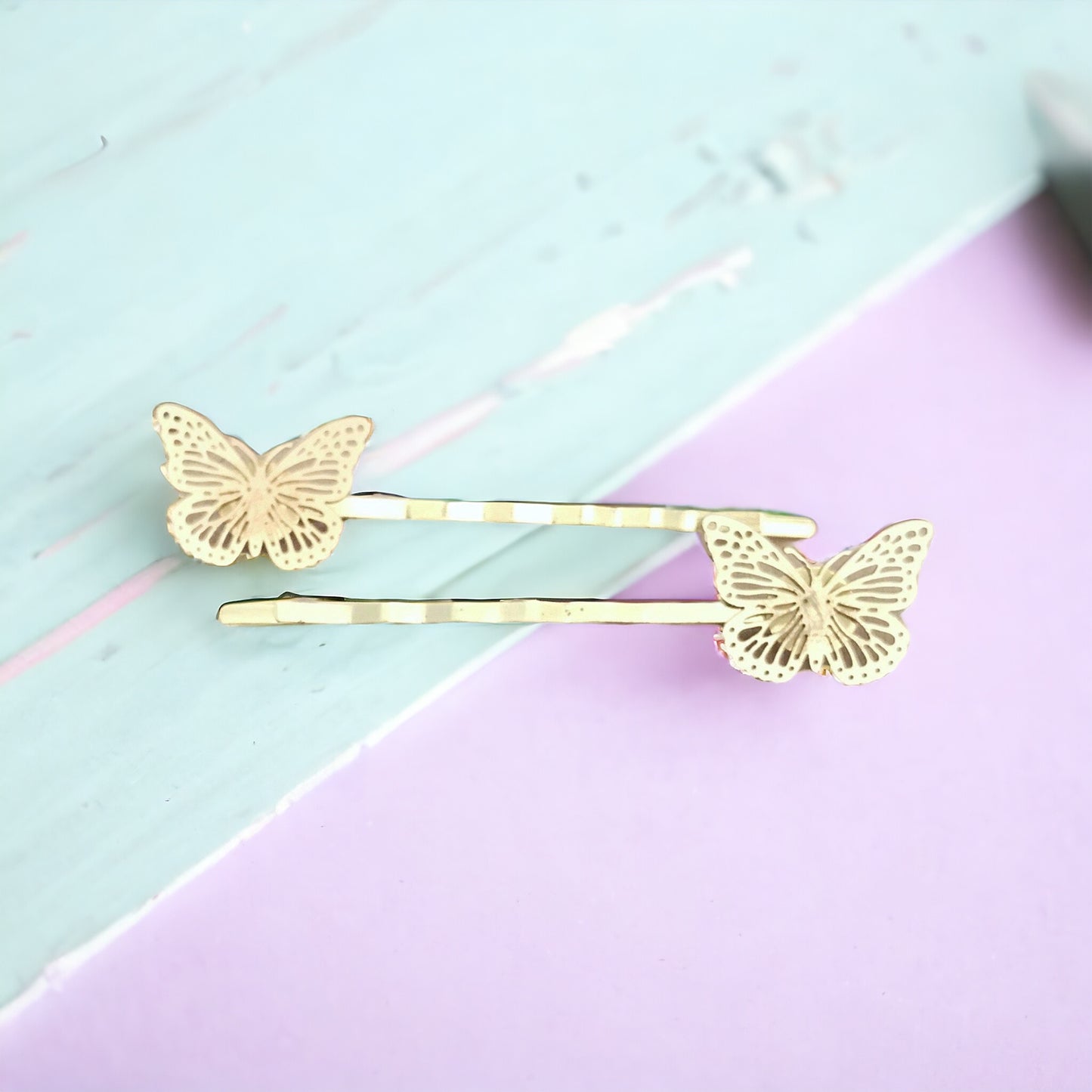 Close-up view of delicate butterfly embellishments on gold hair pins