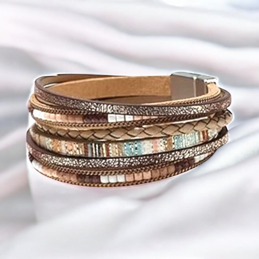 Flat lay of multicolor boho wrap bracelet with faux leather and seed beads