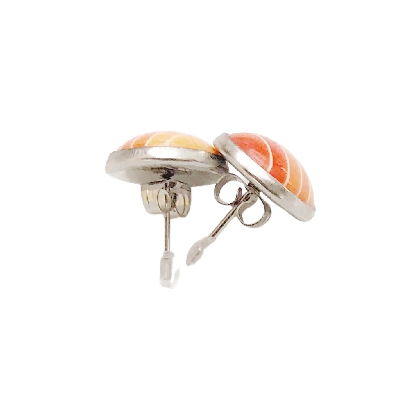Back of round orange gradient striped stud earrings in a silver-tone setting displayed on a white background
