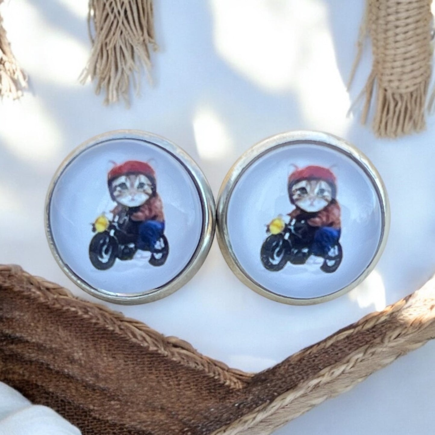 Playful statement earrings shown on wood display background