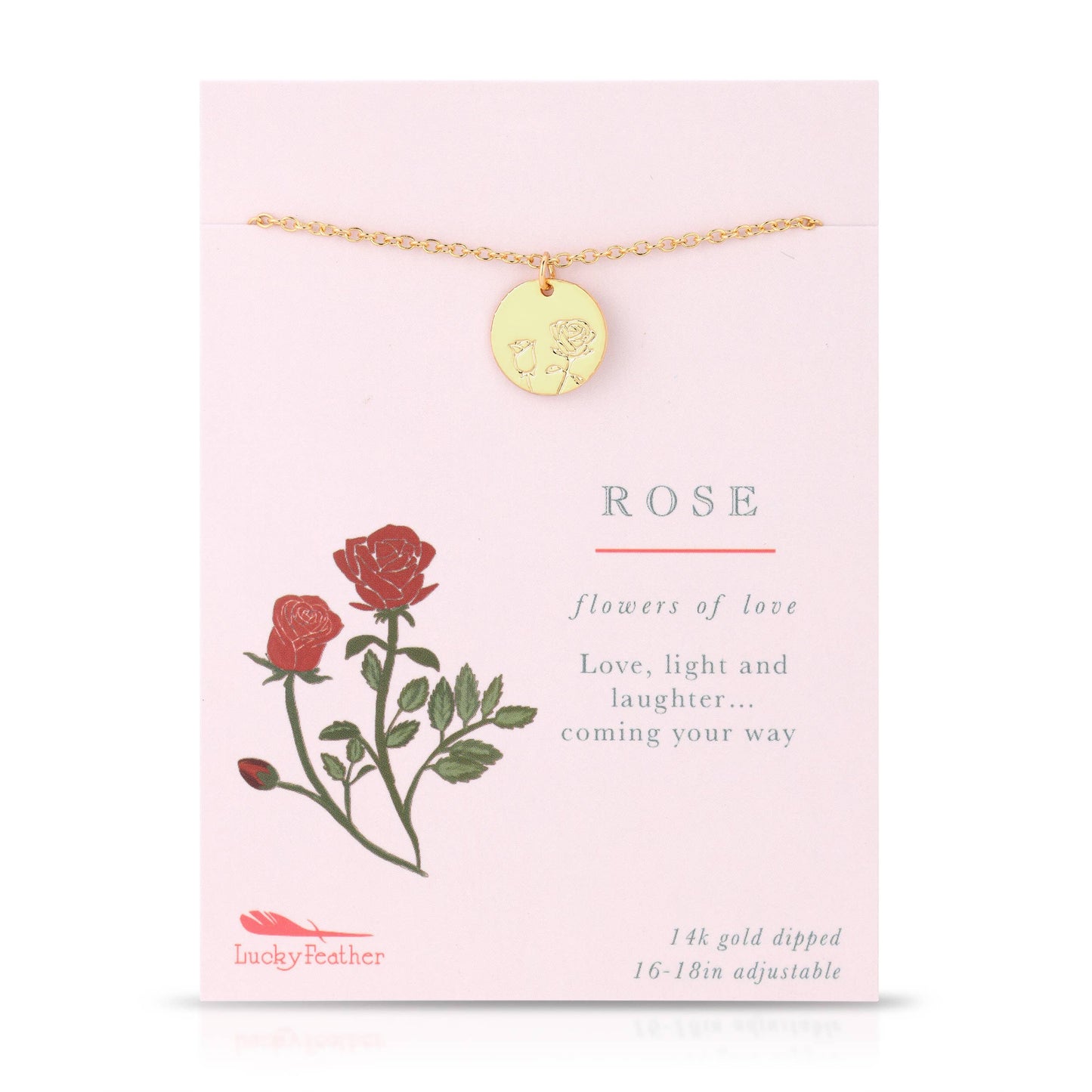 Dainty gold necklace with etched rose pendant styled in flat lay gift display