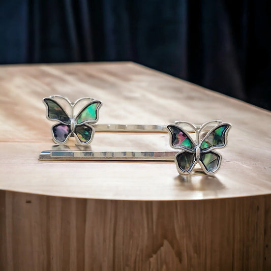 Handmade silver bobby pins featuring iridescent abalone butterfly designs