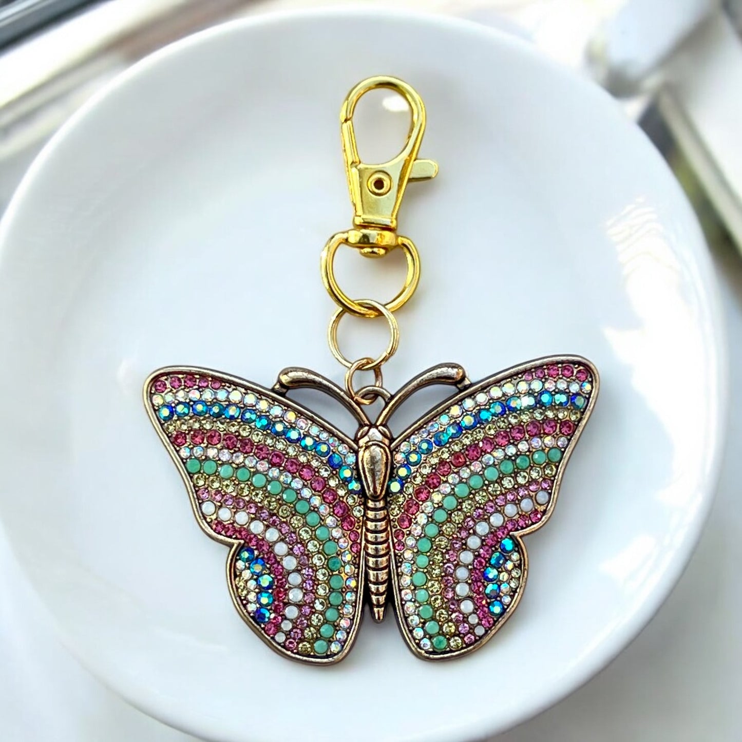 Sparkly rhinestone butterfly bag clip with spring-inspired colors