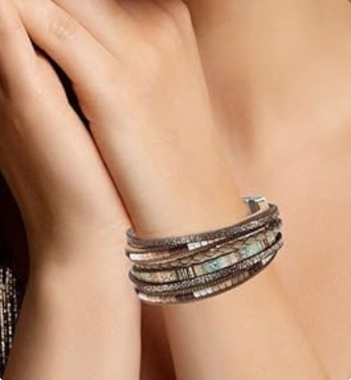 Model wearing multicolor boho bracelet styled with casual layered look