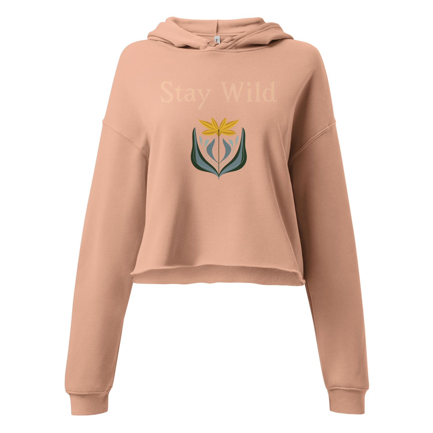Close-up of Stay Wild quote graphic on peach hoodie with floral artwork