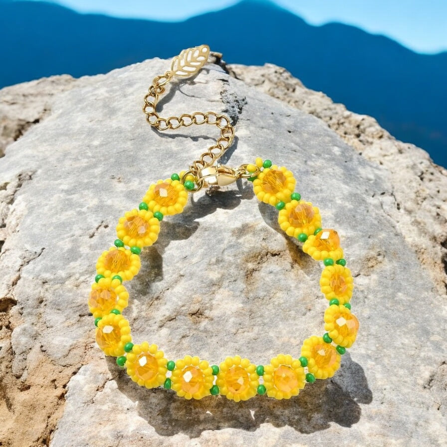 Yellow sunflower bracelet worn on wrist with casual boho clothing