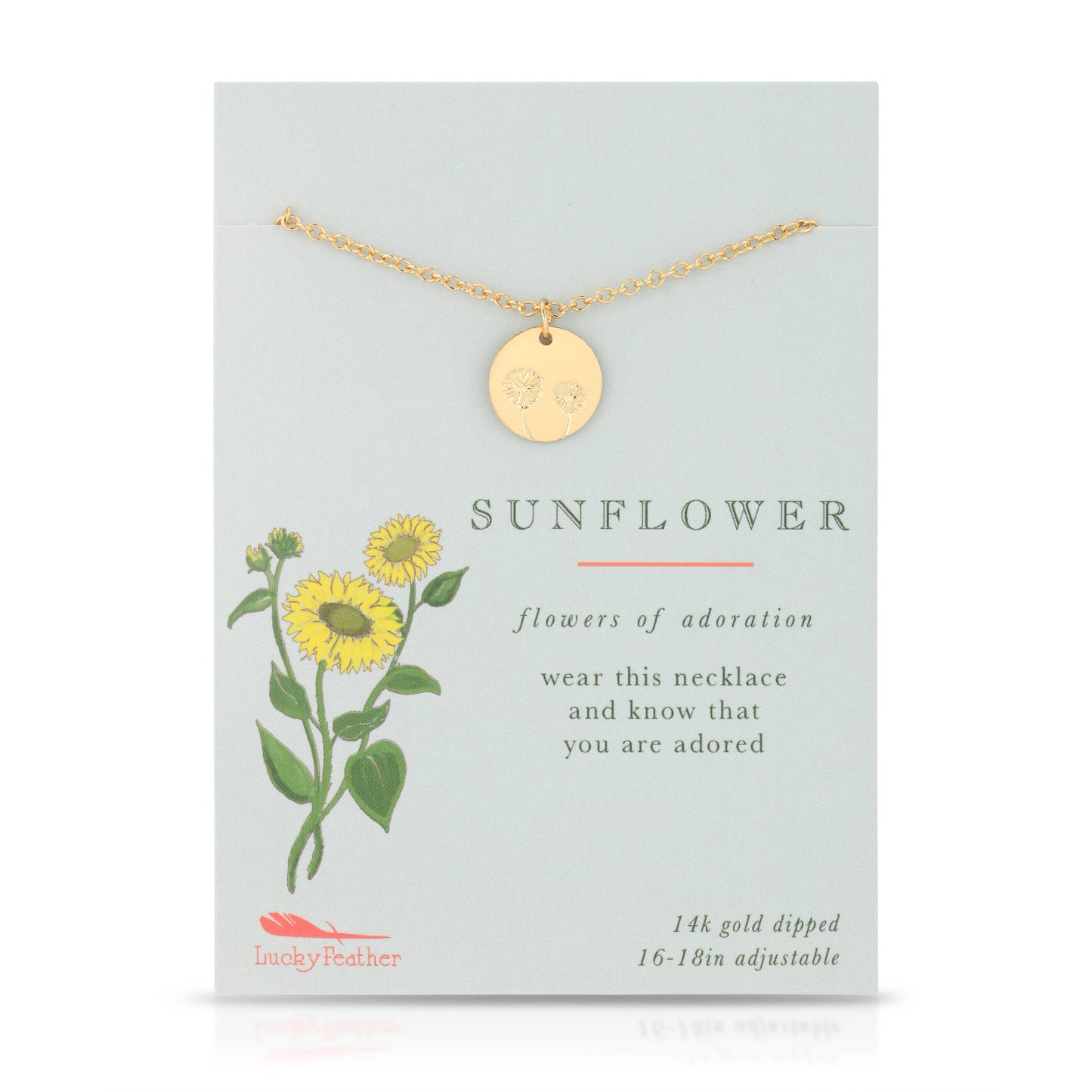 Gold sunflower necklace styled with summer floral gift props