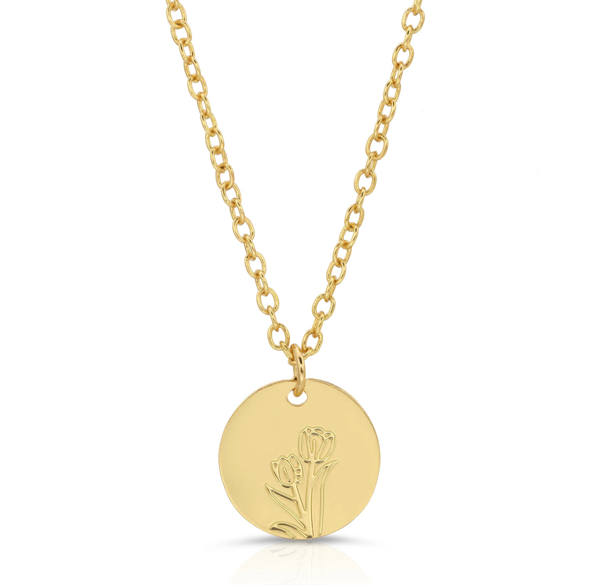Close-up of gold tulip pendant with minimalist floral design