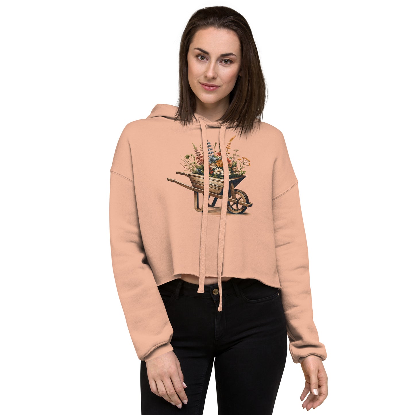 Peach wheelbarrow floral hoodie on model – front view with rustic garden print
