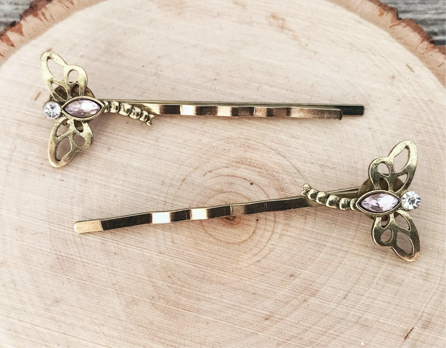 Side angle showing length and detail of gold dragonfly bobby pins