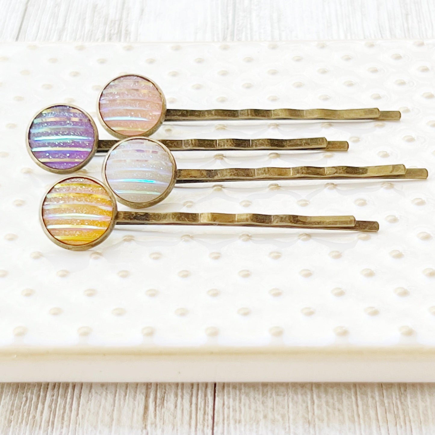 Set of 4 Brass-Toned Hair Pins: Vibrant Accents in Purple, Yellow, Pink, and White Striped Glitter Design