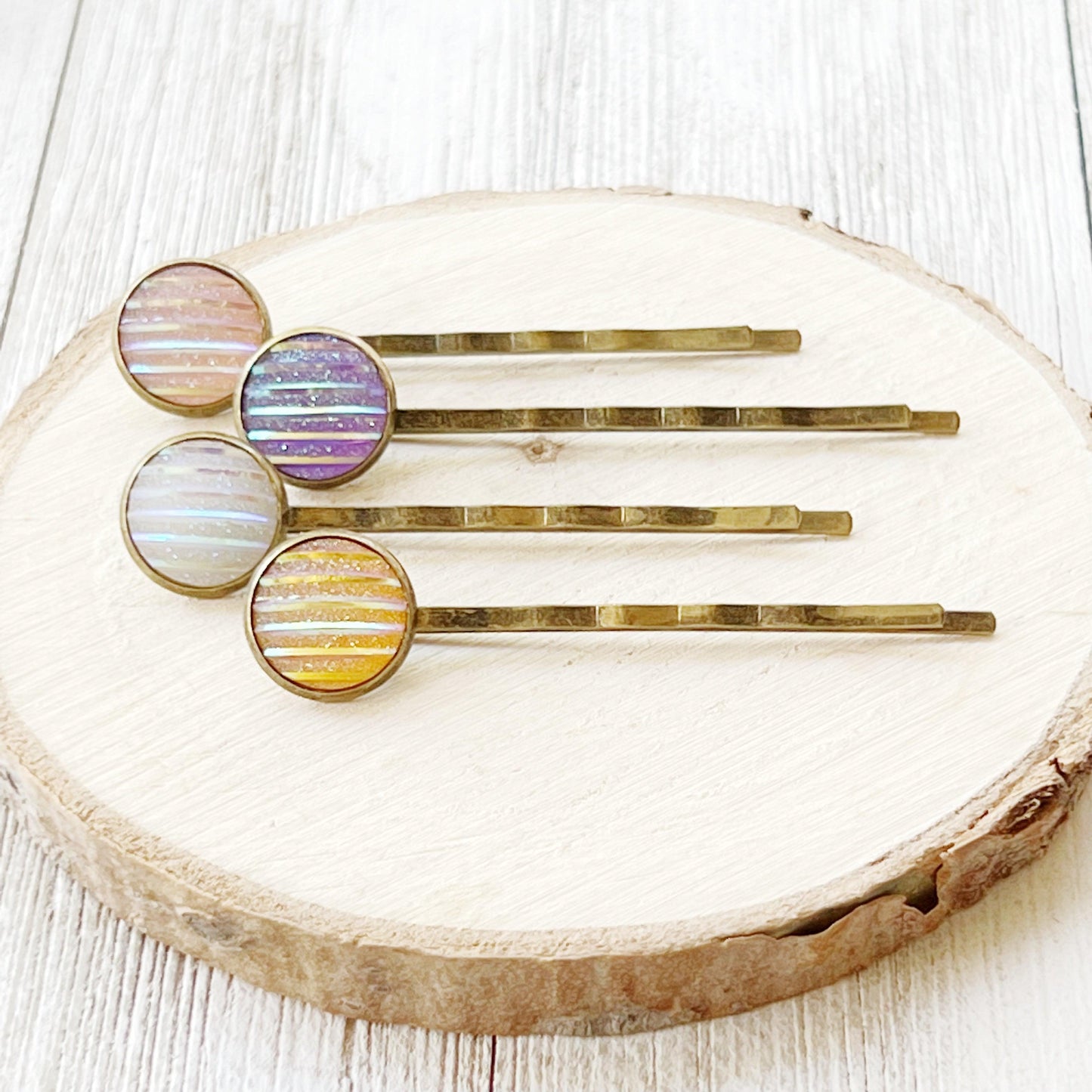 Set of 4 Brass-Toned Hair Pins: Vibrant Accents in Purple, Yellow, Pink, and White Striped Glitter Design