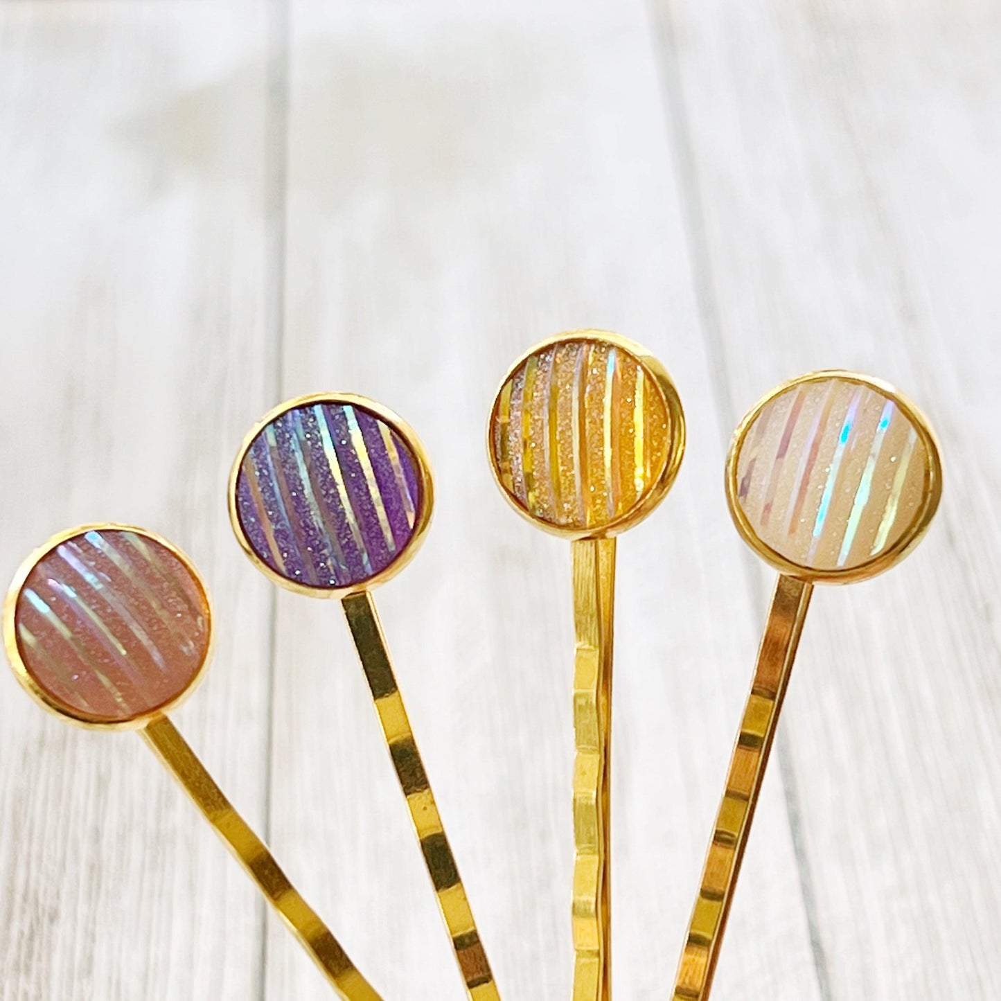 Set of 4 Gold-Toned Hair Pins: Vibrant Accents in Purple, Yellow, Pink, & White Striped Glitter Design