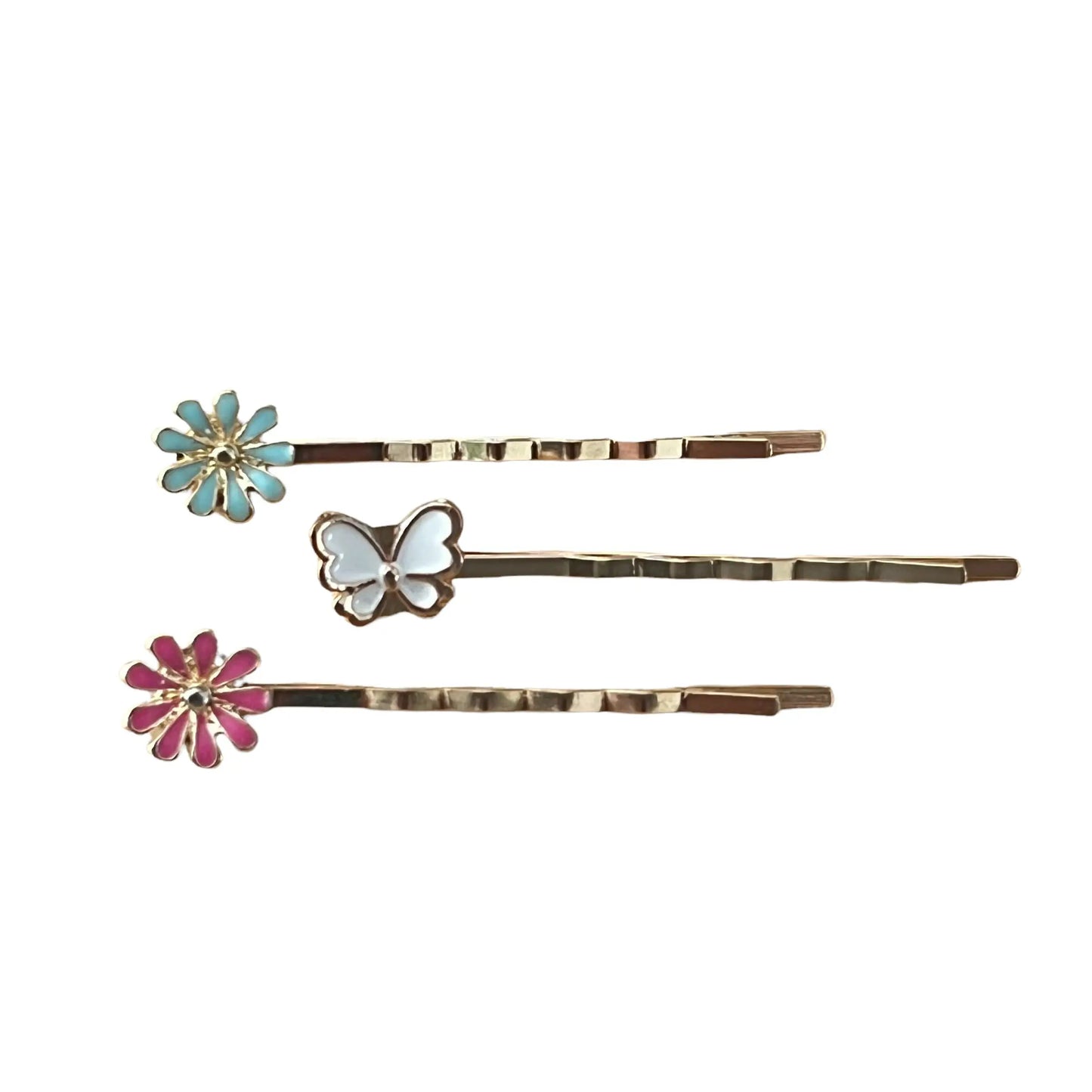 Close-up of white butterfly and flower hair pins with detailed texture