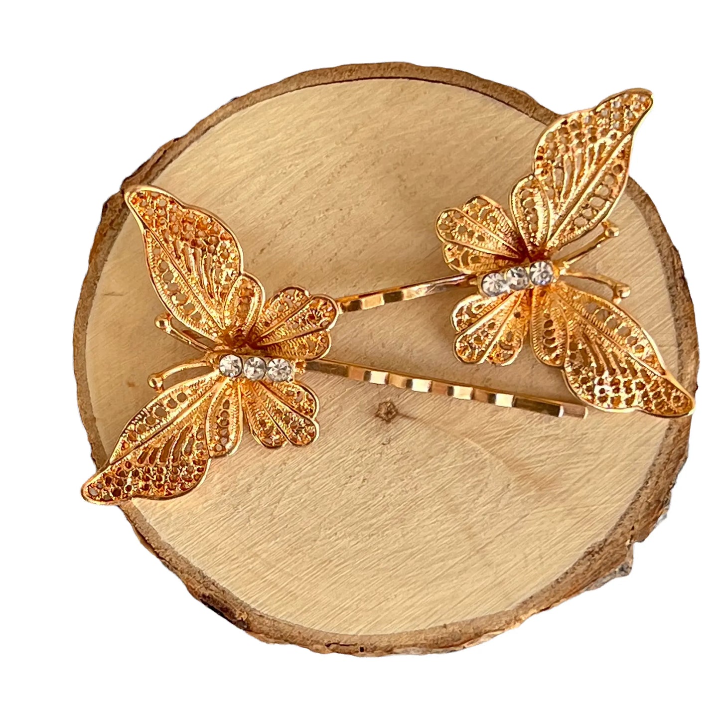 Measurement grid showing size of gold filigree butterfly hair pins