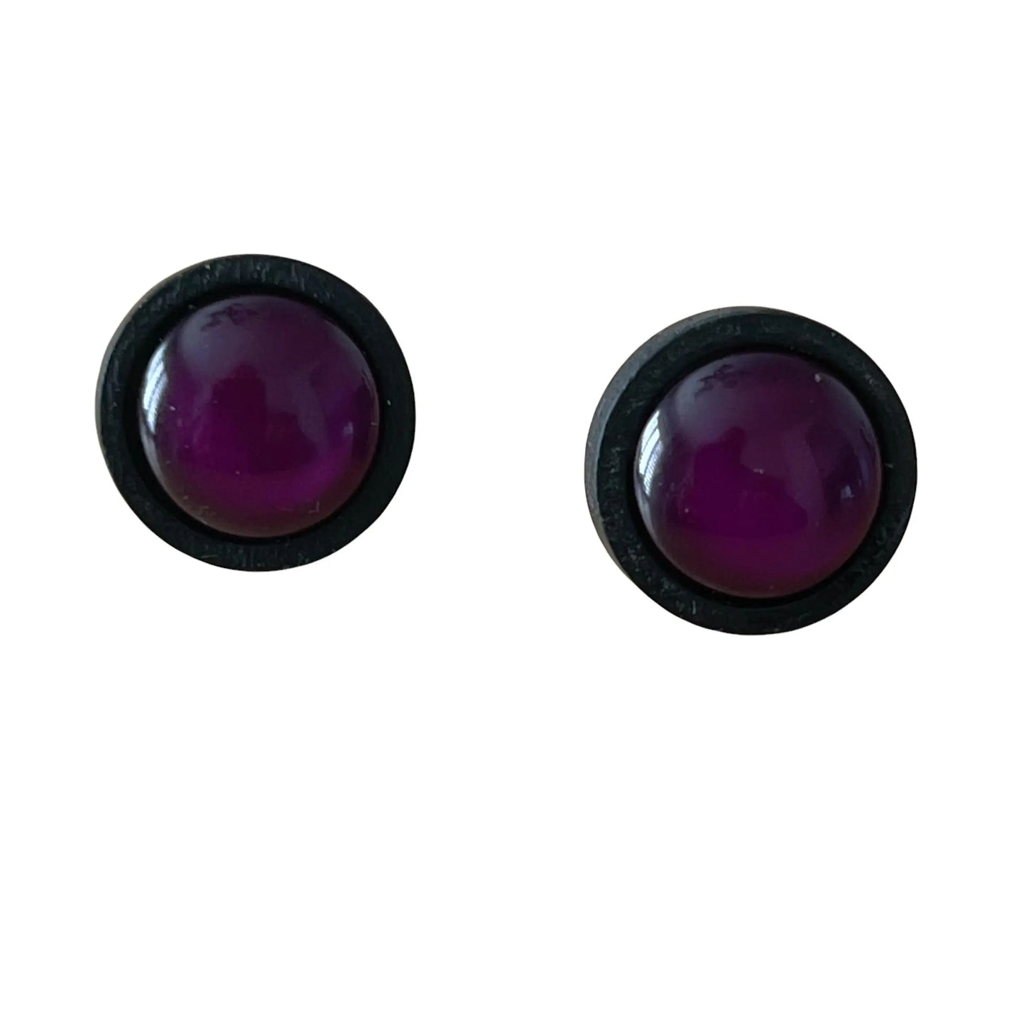 Pair of round purple earrings with black rims on a white background
