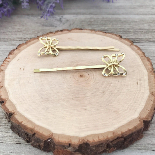 Delicate gold butterfly hair clips shown as a gift set
