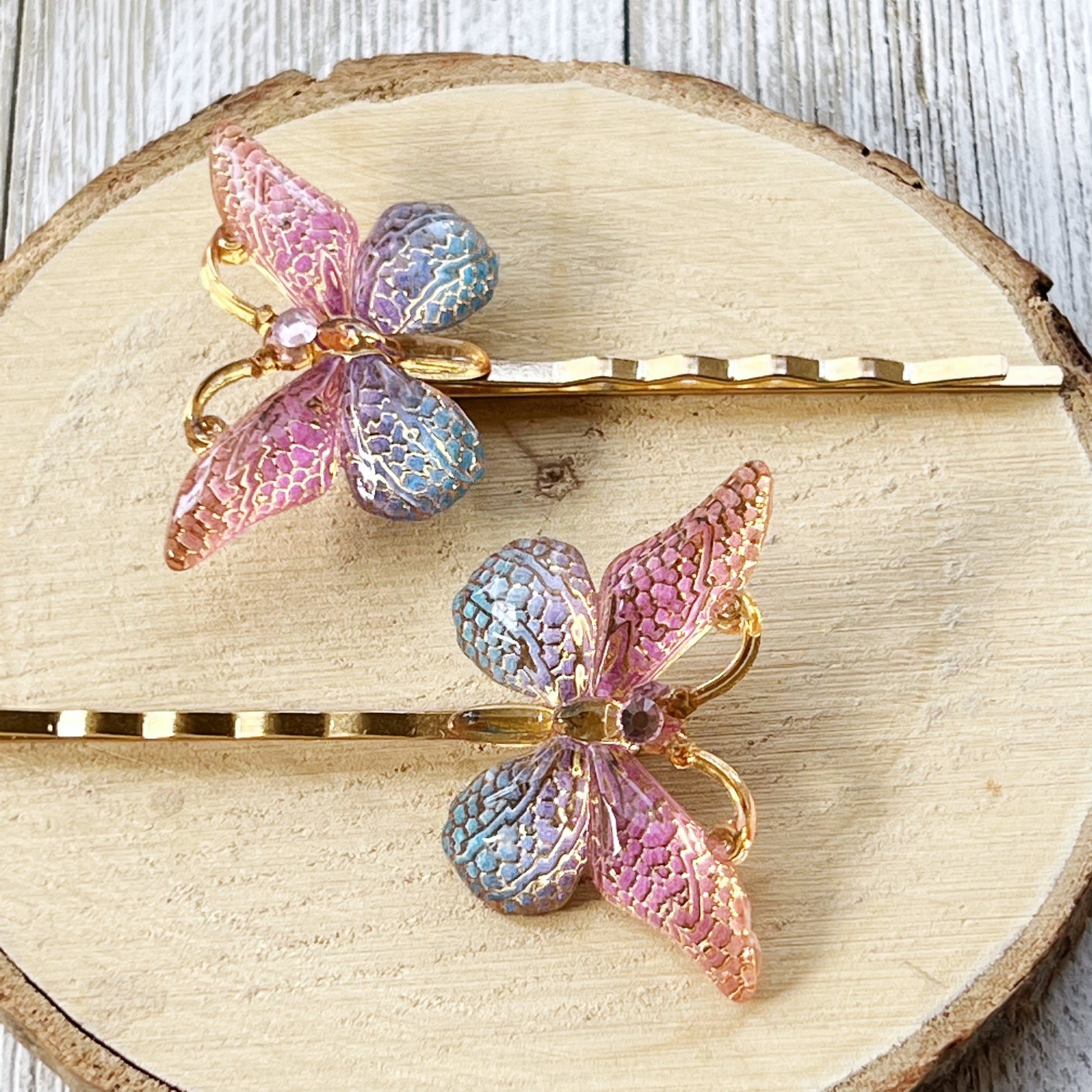 Large Acrylic Butterfly Hair Pins: Vibrant Pink, Blue & Gold tones with Rhinestone Accents for Statement Hairstyles