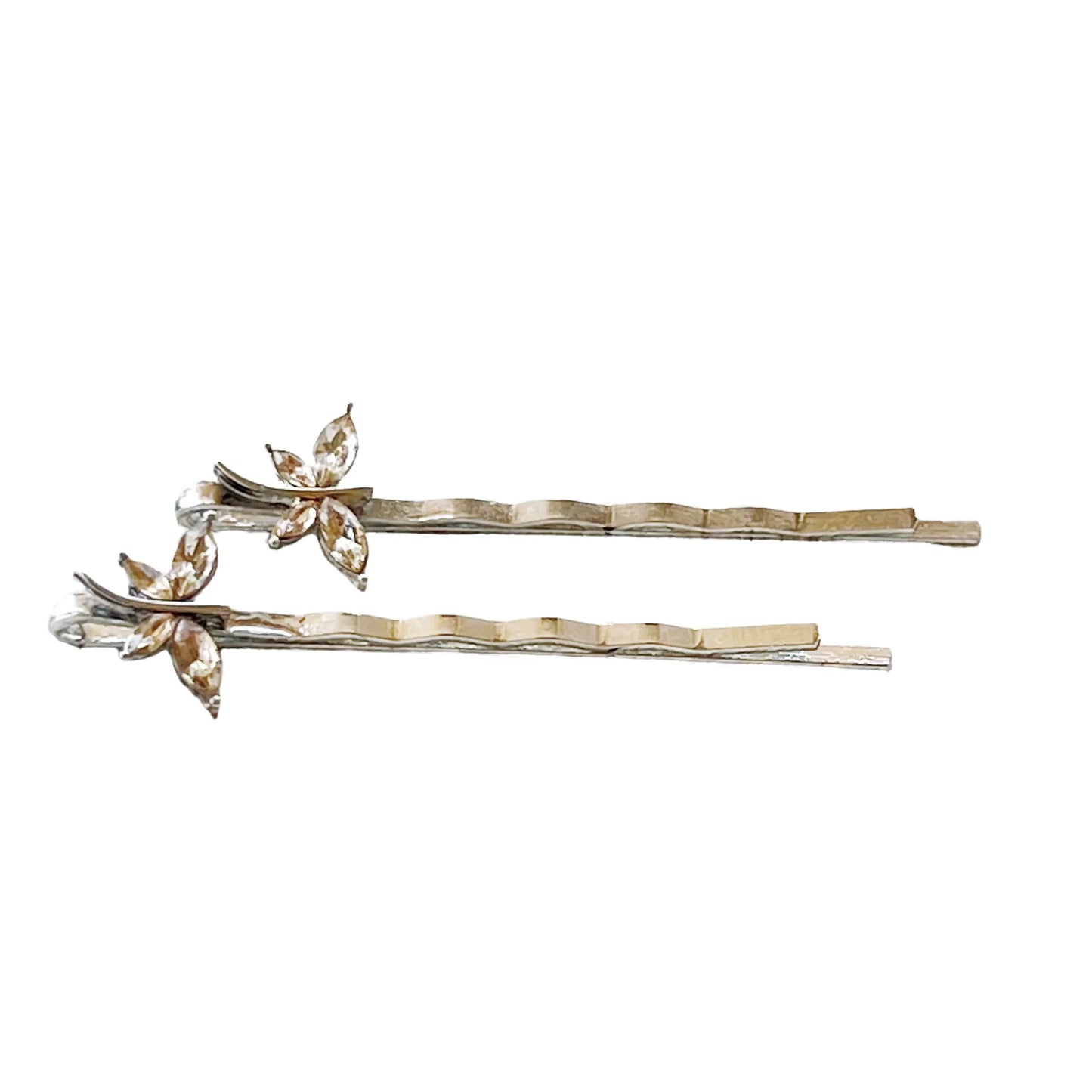 Light brown dragonfly hair pins shown with size reference grid