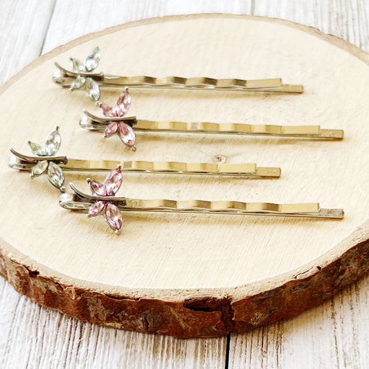 Set of green and pink dragonfly hair pins styled for spring gifting