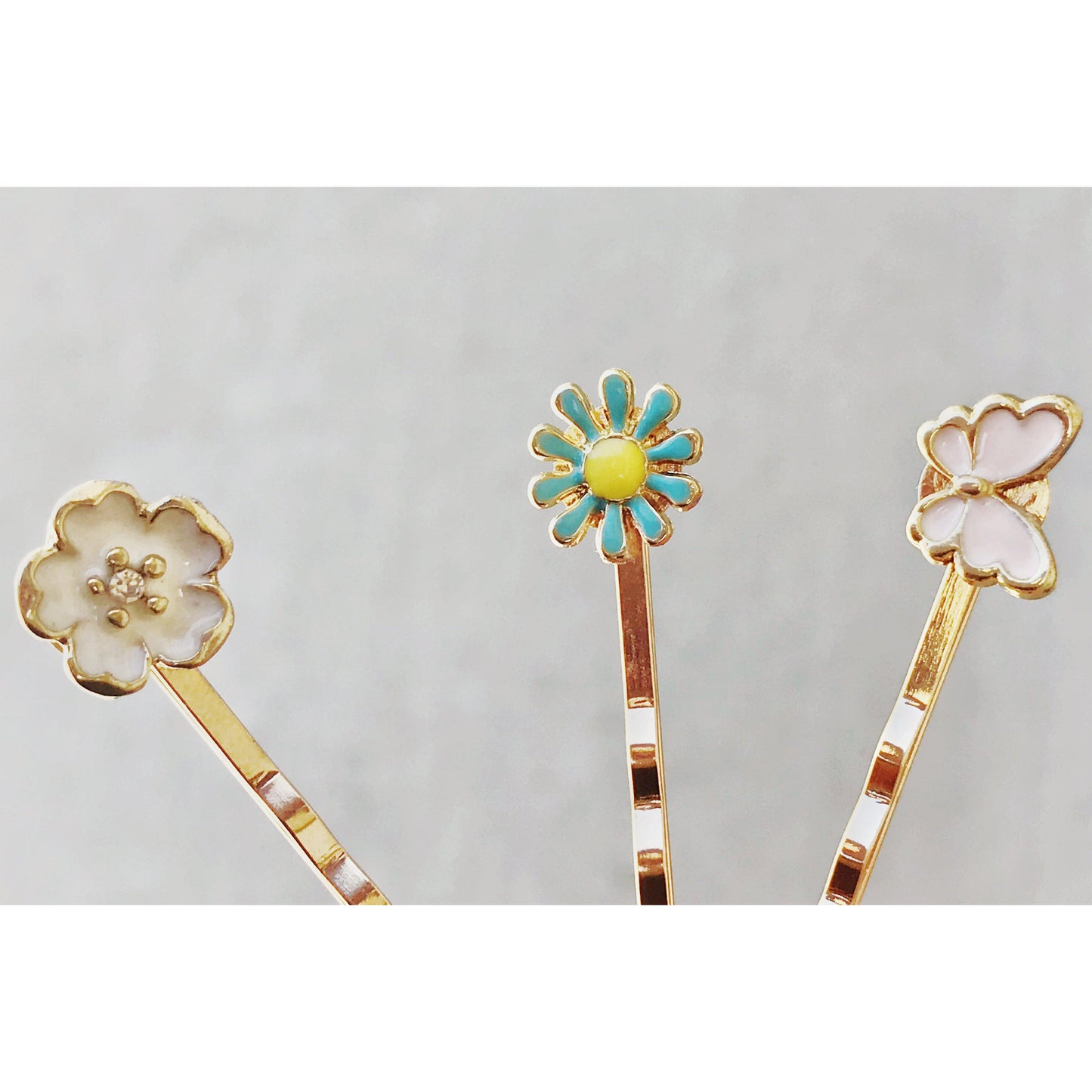 Measurement photo showing size of butterfly and flower hair pins