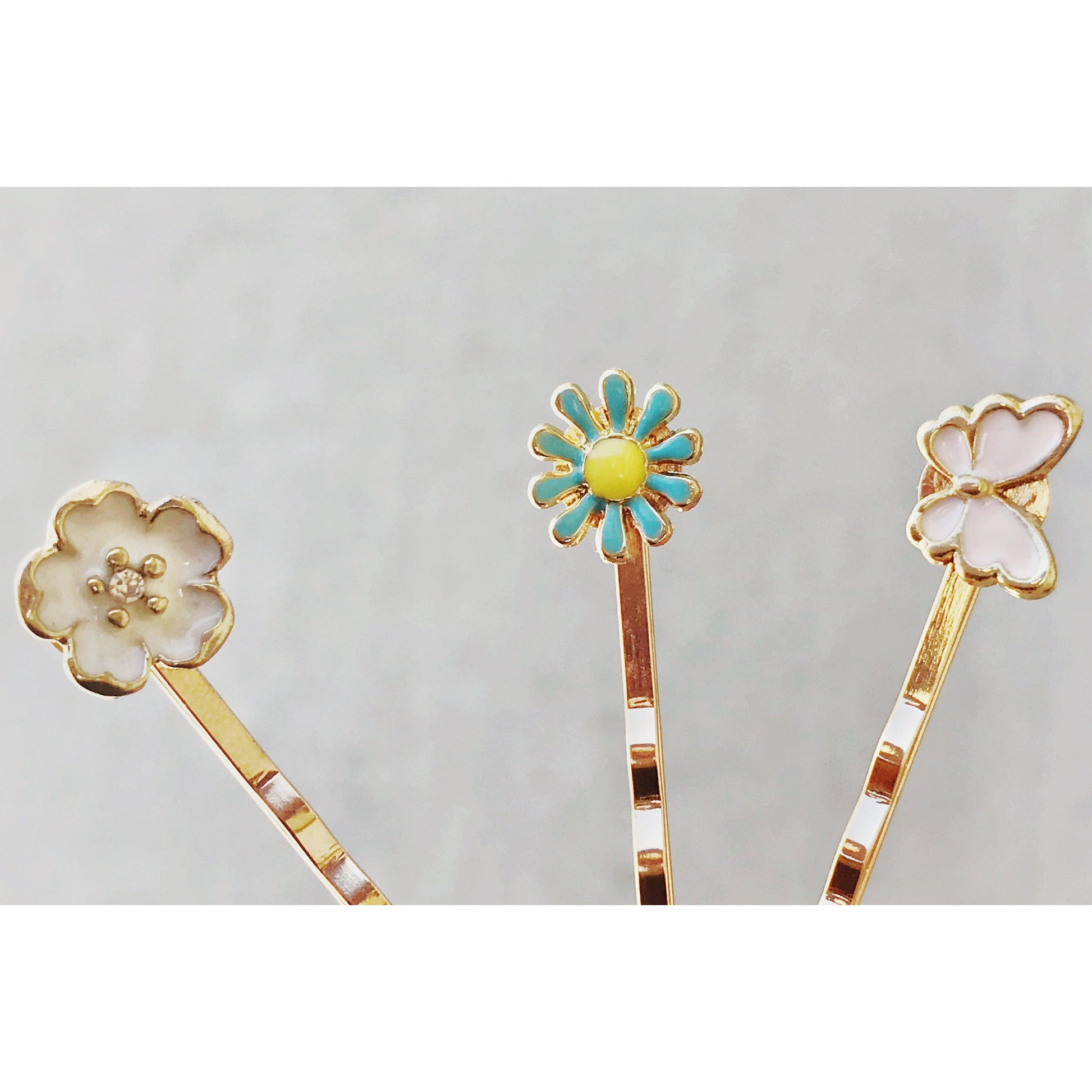 Measurement photo showing size of butterfly and flower hair pins