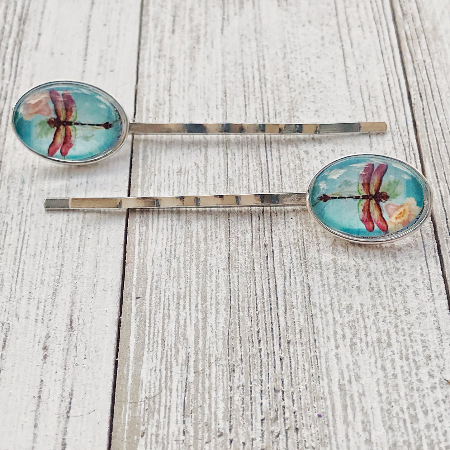 silver bobby pins with floral and insect charms – styled for spring or gifting