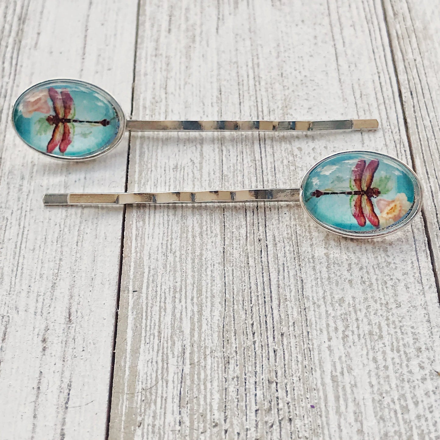 silver bobby pins with floral and insect charms – styled for spring or gifting