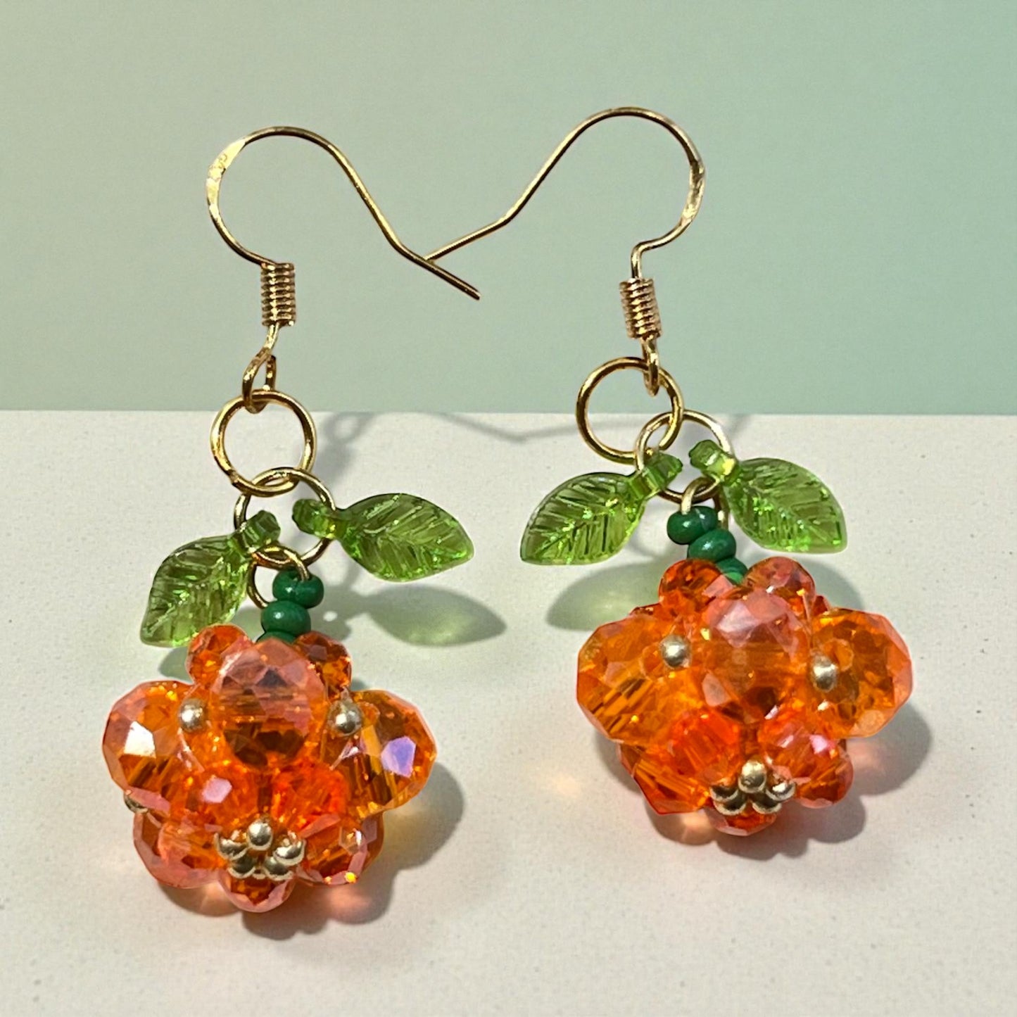Beaded Pumpkin Earrings – Sparkly Fall Dangles with Green Leaves