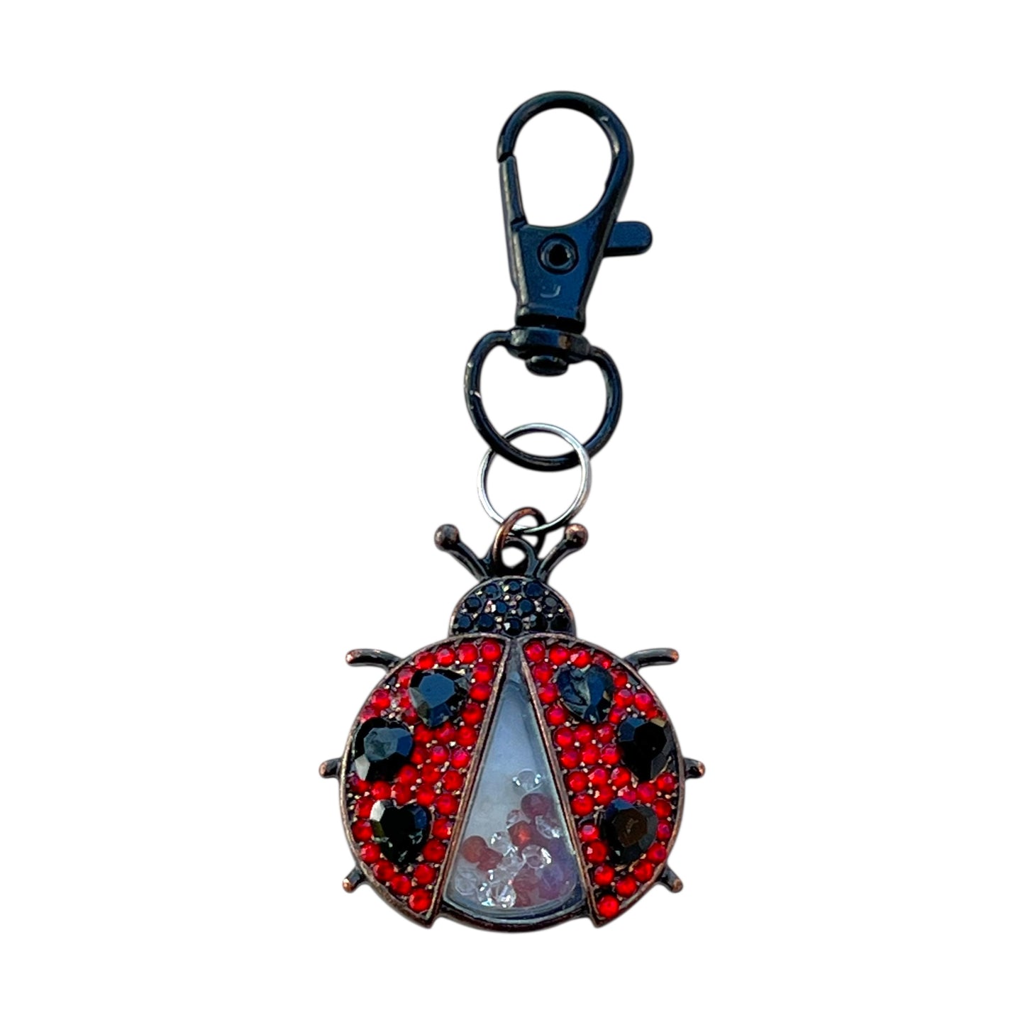 Keychain with a ladybug design on a white background