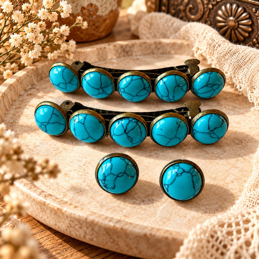 Two five-stone turquoise western barrettes and a matching pair of stud earrings styled on a cream tray