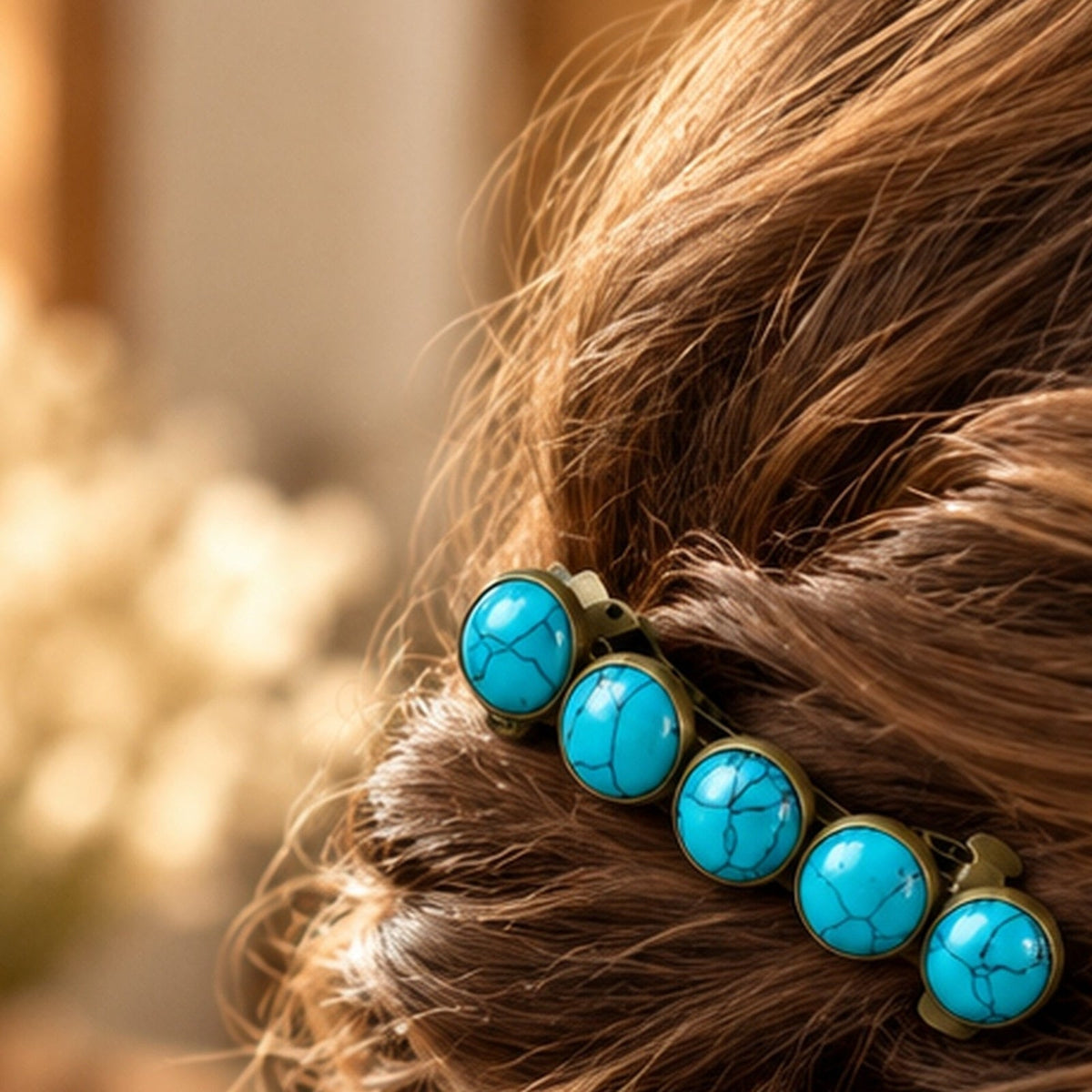One five-stone bronze-tone faux-turquoise barrette worn in soft half-up waves; styling inspiration for set of two