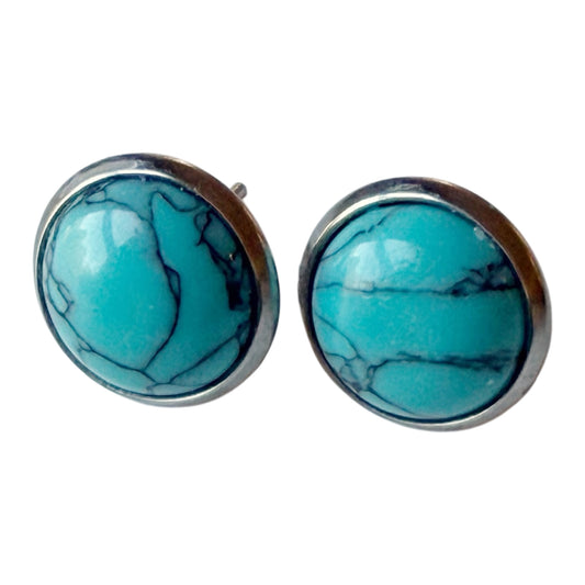One pair of silver-tone 10 mm nominal round faux-turquoise stud earrings shown on clean white