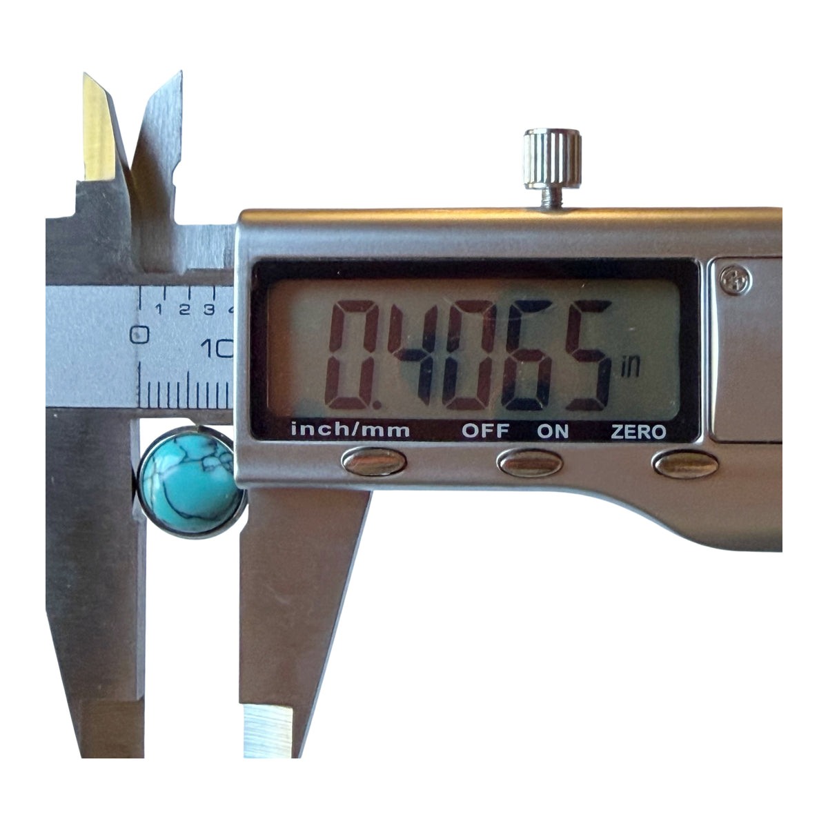 Digital caliper measuring one of the round turquoise stud earrings approximately 0.4065 inches