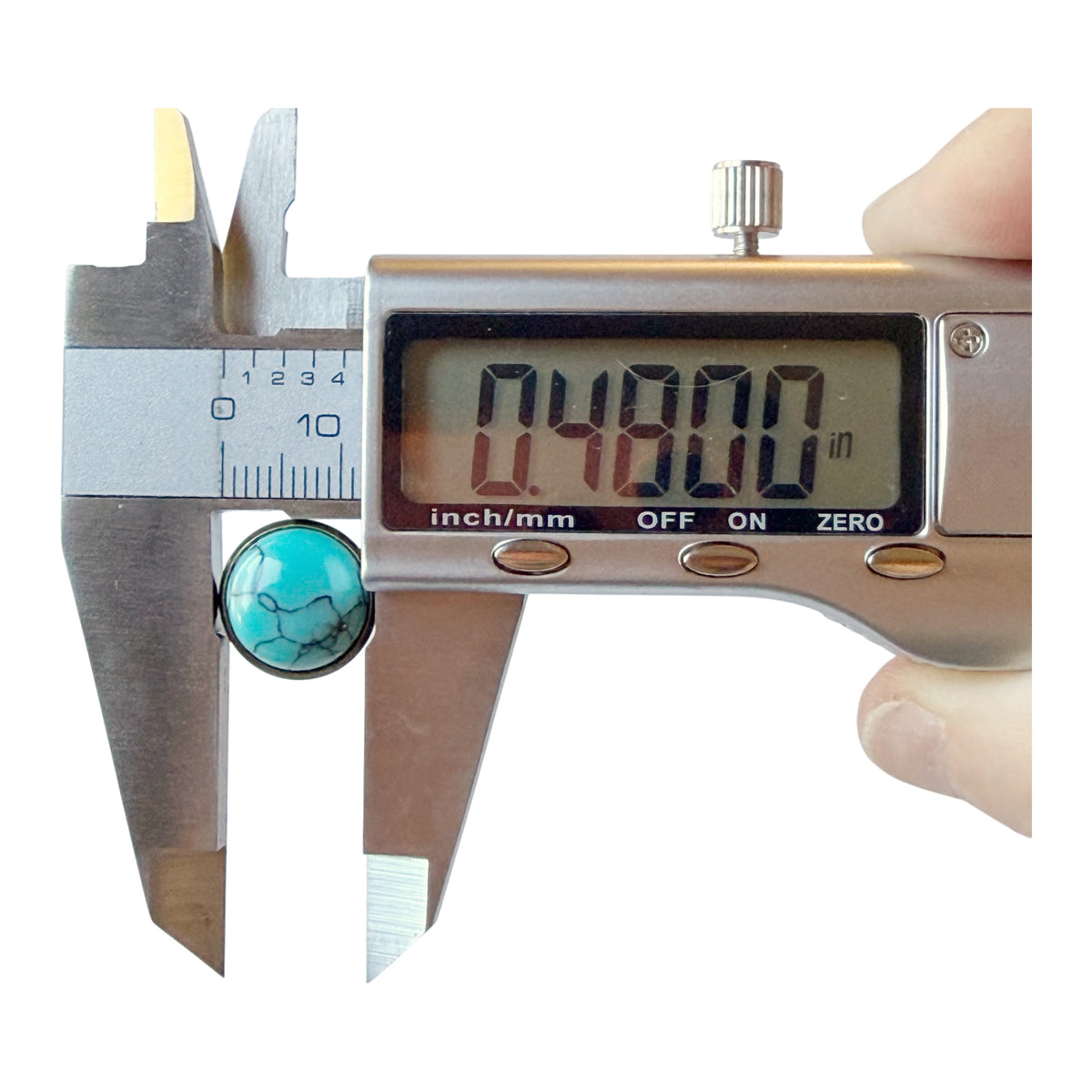 Digital caliper showing one antique brass-tone turquoise earring approximately 0.4800 inches across