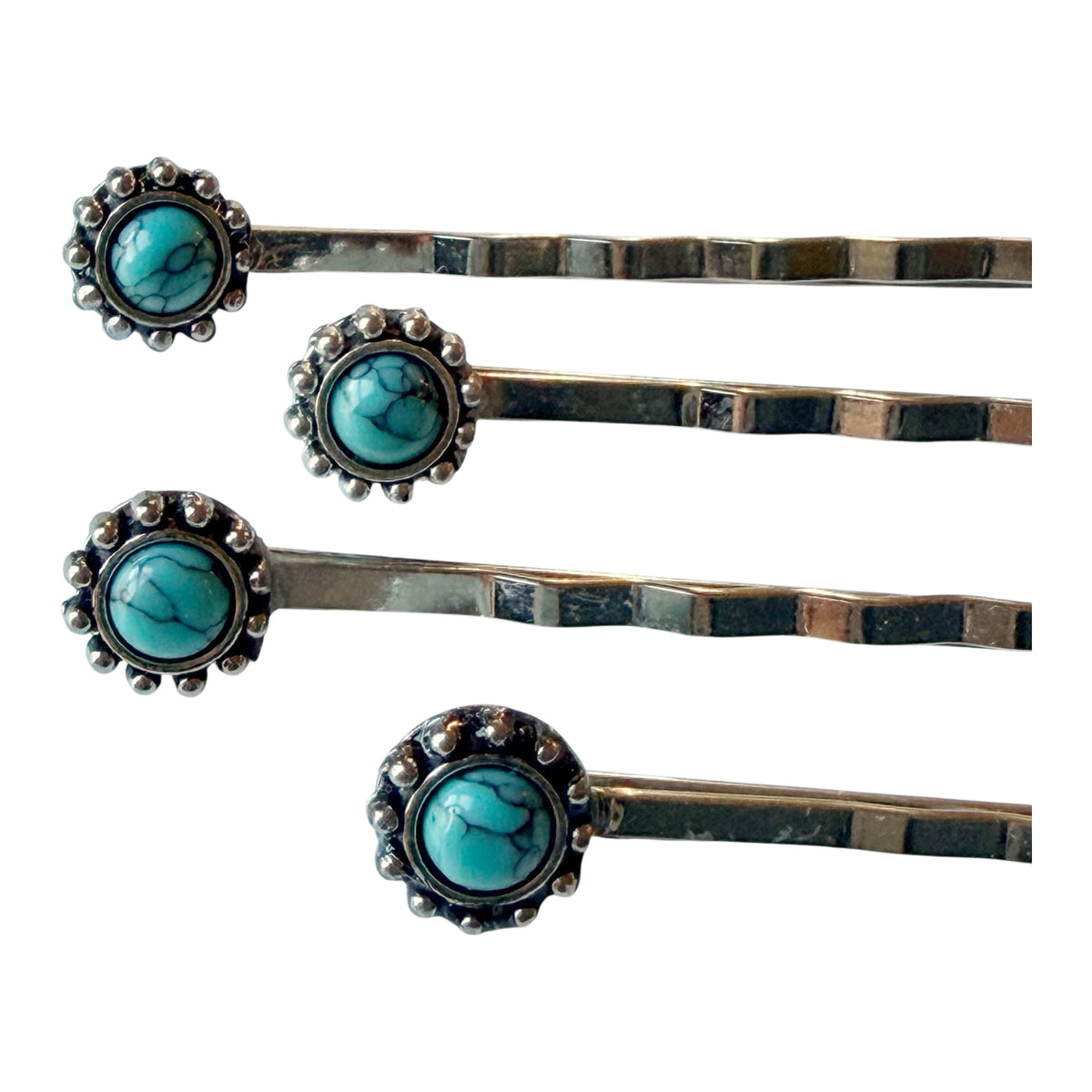 Close-up of all four F31 faux-turquoise silver-tone bobby pins included in set