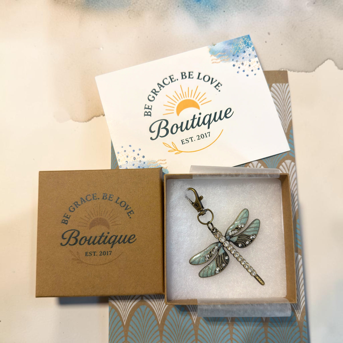 Be Grace Be Love Boutique gift-ready packaging for the mint rhinestone dragonfly purse charm.