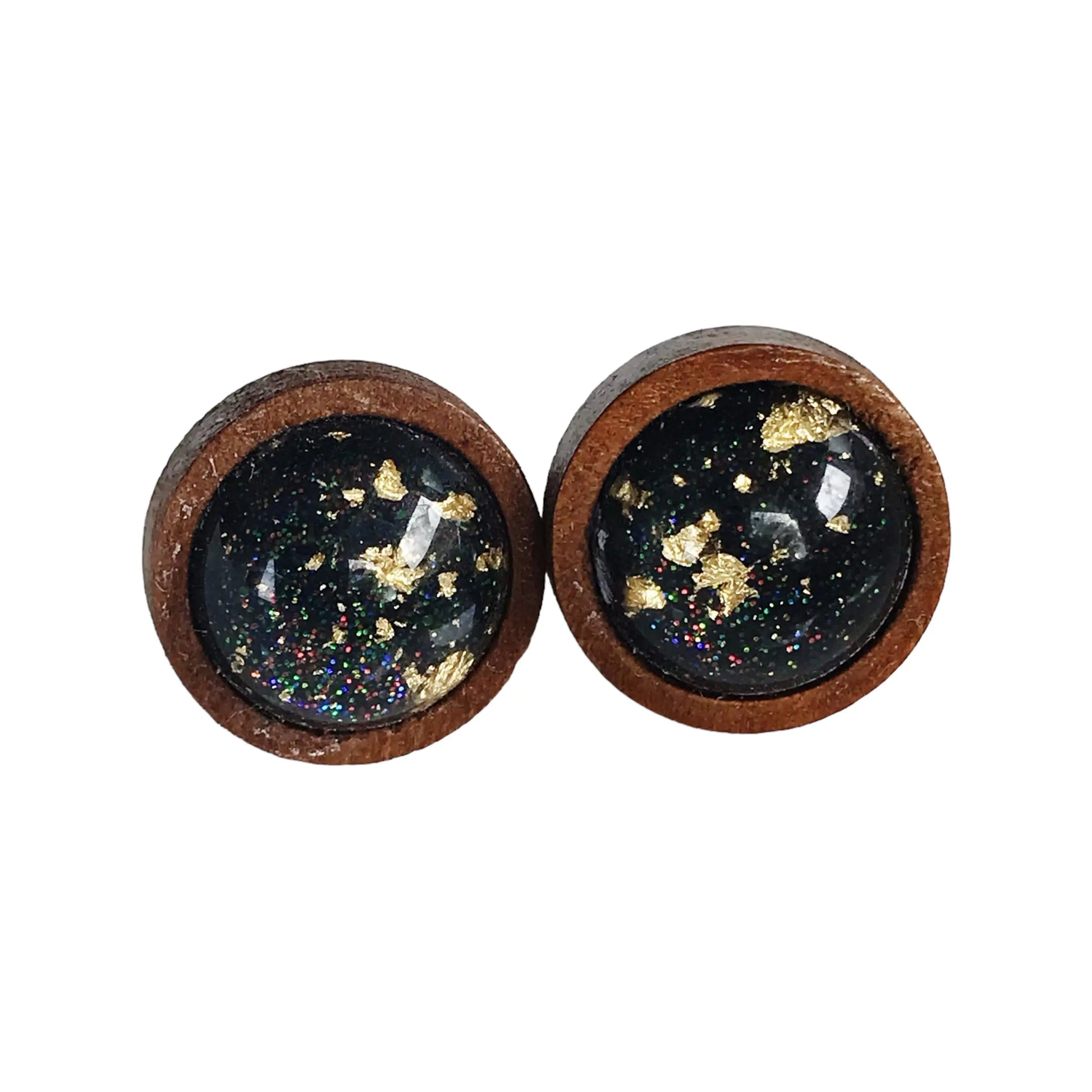 Round black resin wood stud earrings with gold flake detail and subtle sparkle on a white background 