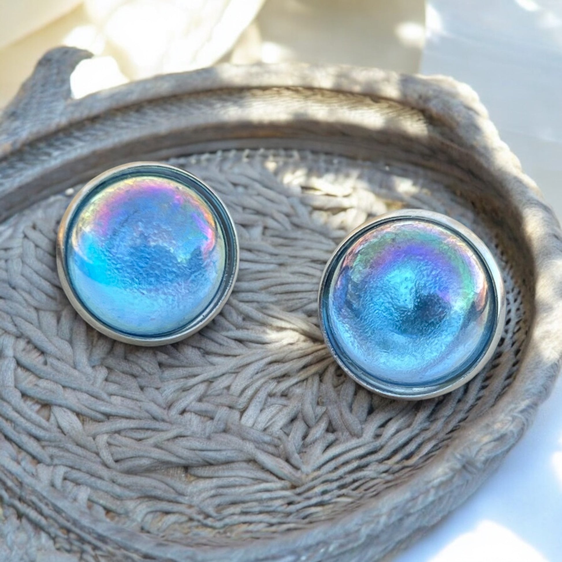 Gift-ready iridescent stud earrings in packaging display