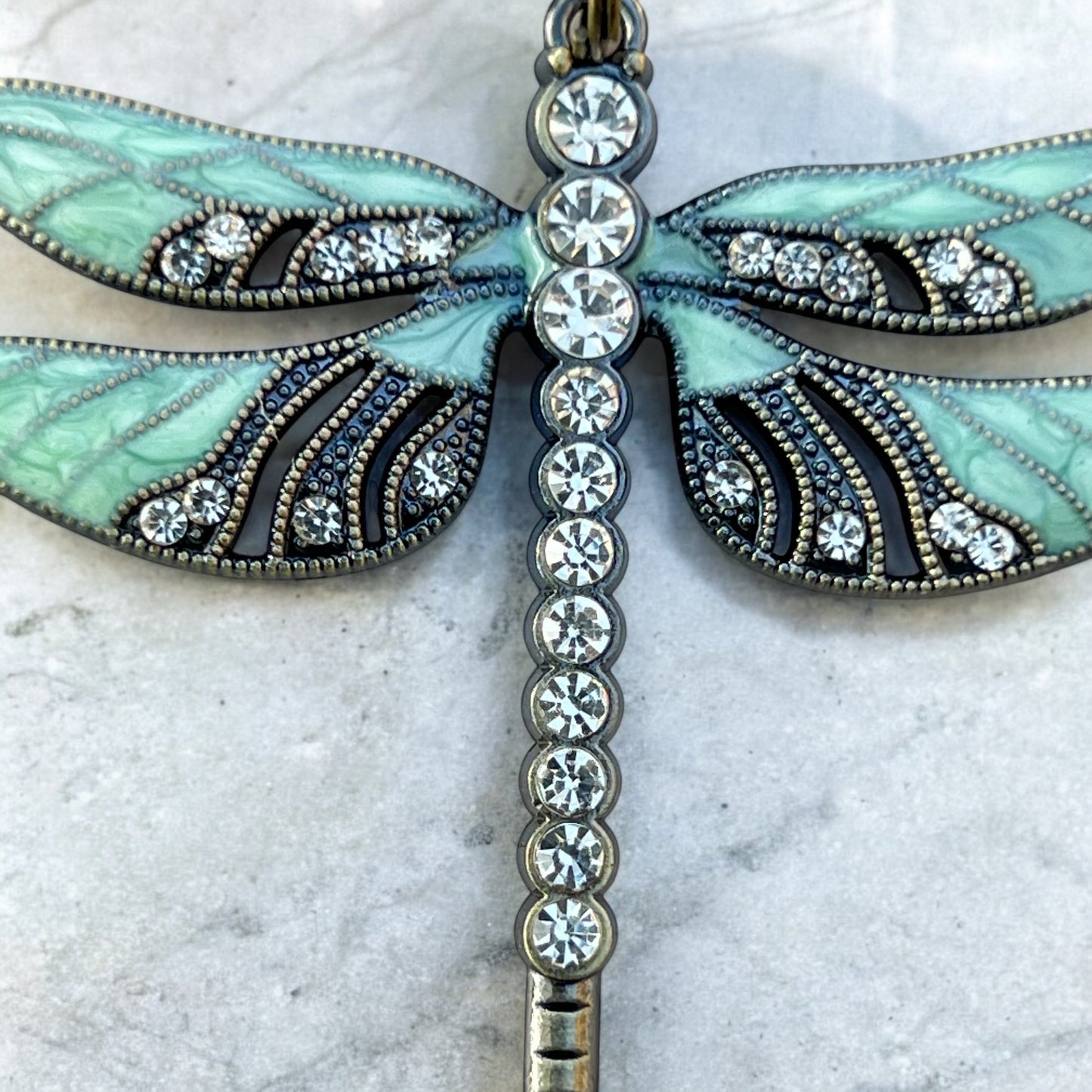 Boho dragonfly purse accessory styled with whimsical props