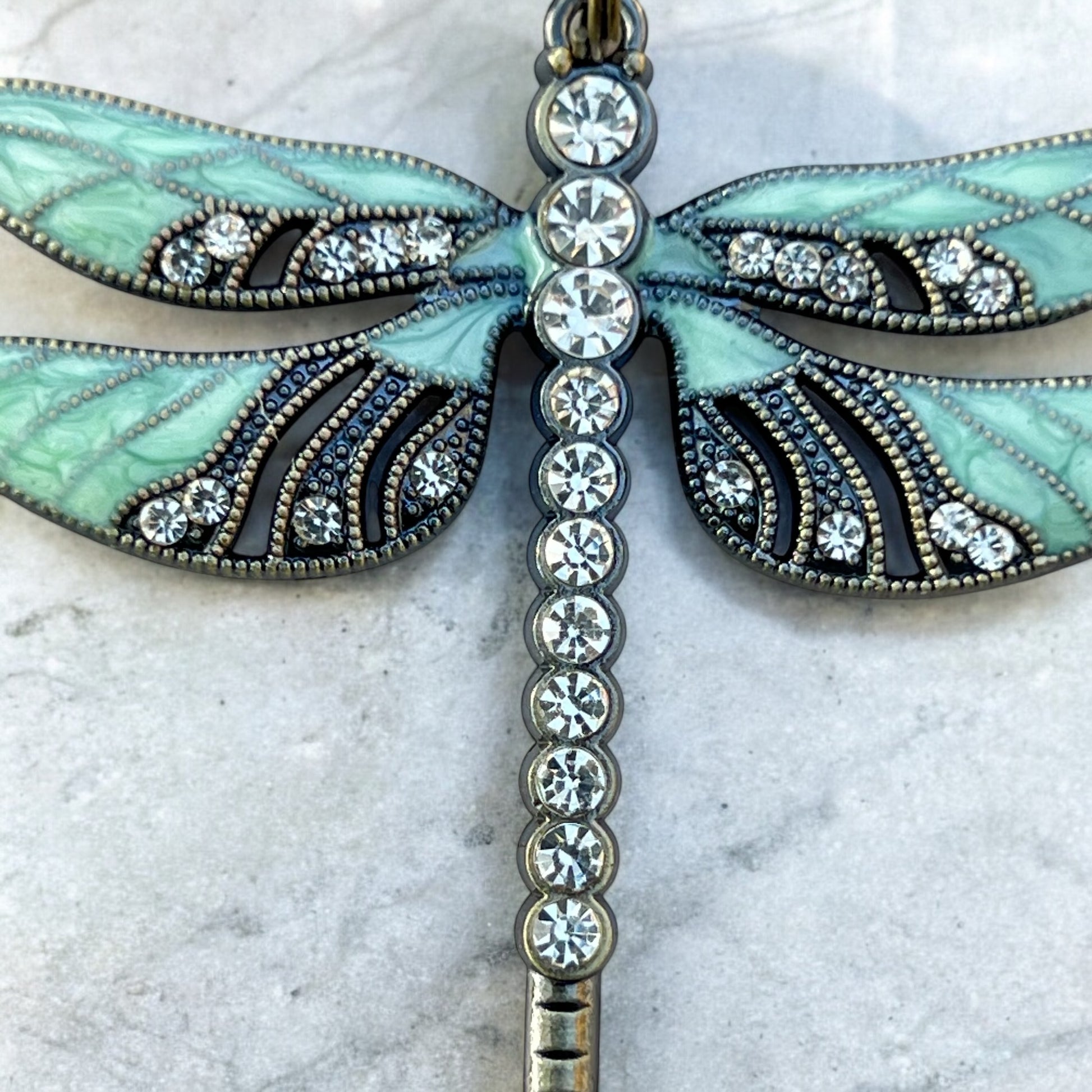 Boho dragonfly purse accessory styled with whimsical props
