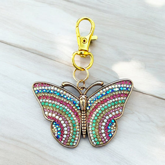 Handmade butterfly purse charm in pink, blue, green, and iridescent white