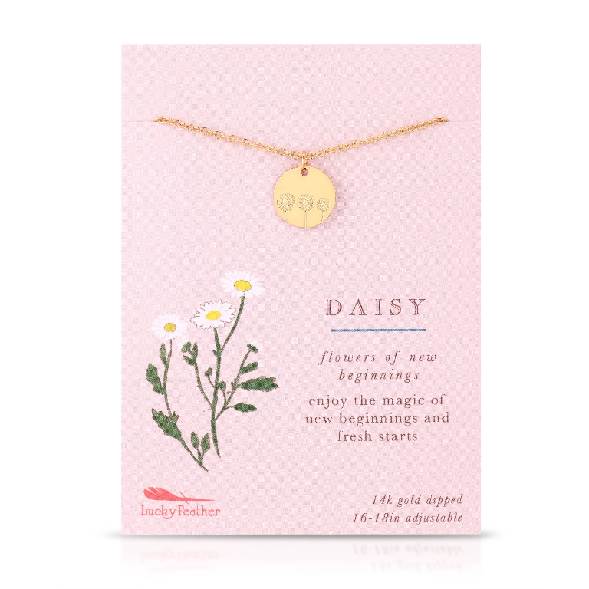 Gold daisy necklace styled with floral accents for gift display